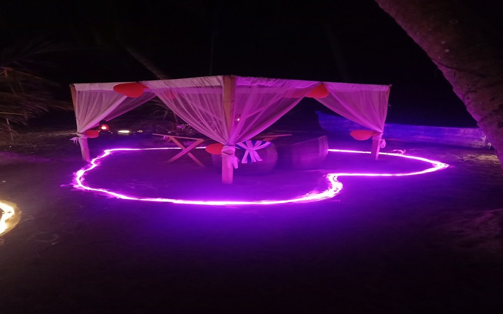 A candlelight dinner arrangement on Havelock Island's beach